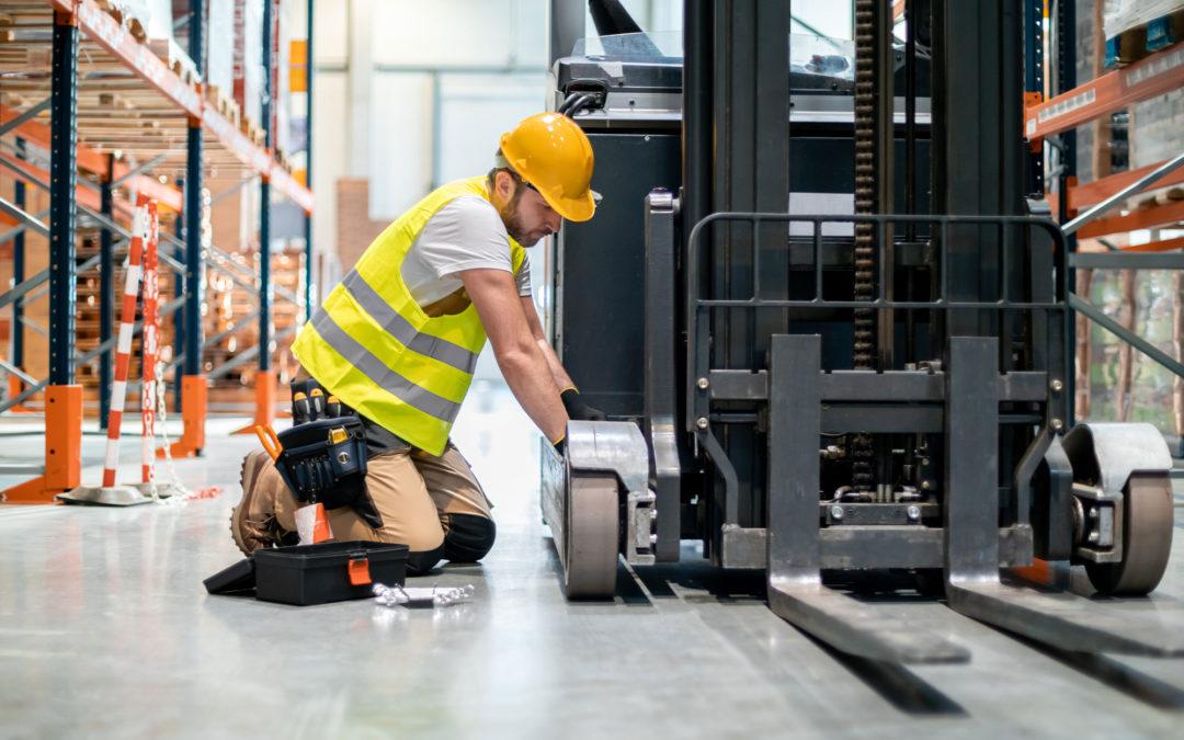 Forklift Mechanic Working On Machine | Schelkovskiy &Co Brennan Equipment Services