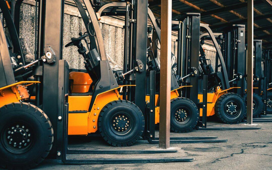 Background Of A Lot Of Forklifts Reliable Heavy Loader Truck | Schelkovskiy &Co Brennan Equipment Services